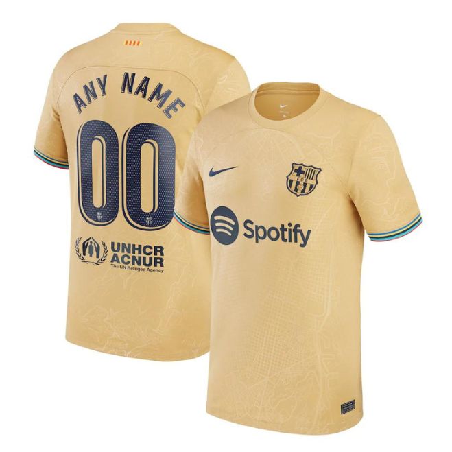 Barcelona 2022/23 away jersey in gold with Spotify logo and customizable name and number by Jerseyteamsworld