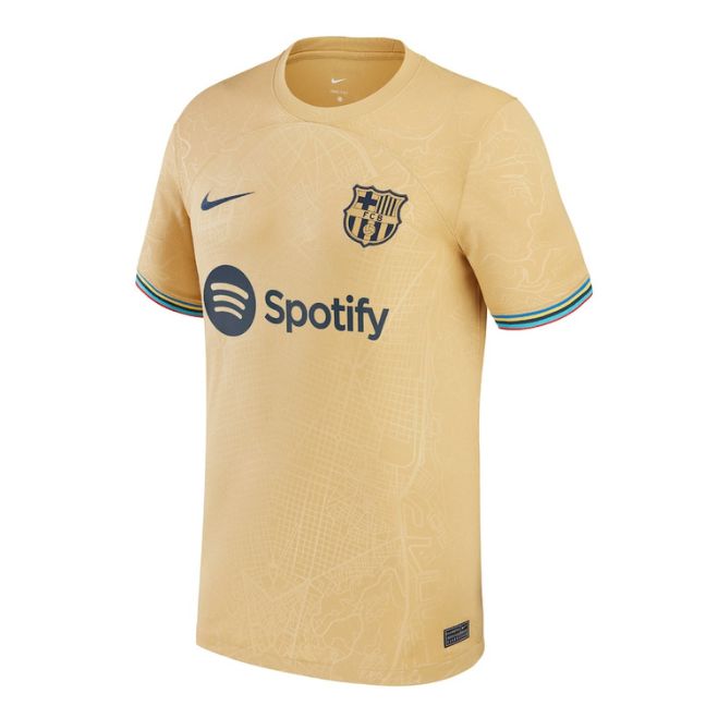 Barcelona 2022/23 away jersey in gold with Spotify sponsor logo and club crest by Jerseyteamsworld