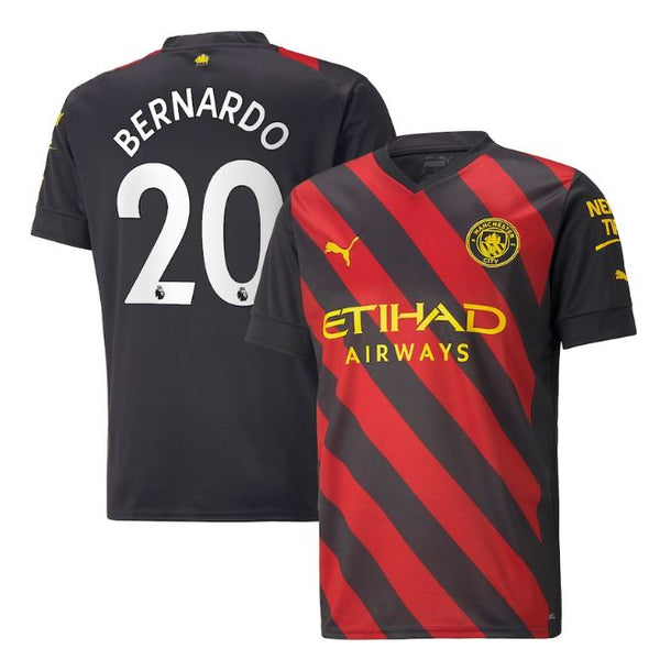 Bernardo Silva Manchester City Puma Jersey 2023 showing front red and black diagonal stripes and back with name and number 20