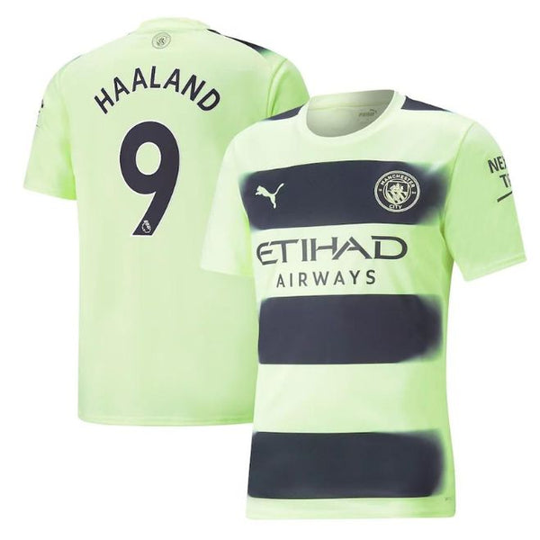 Erling Haaland Manchester City jersey in light green with black stripes and team logos by Jerseyteamsworld